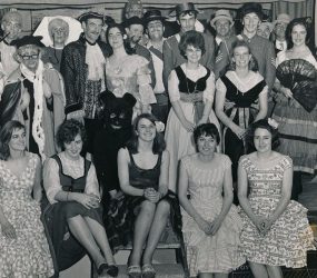Full cast pictured on stage