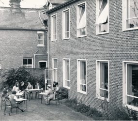 Nurses sitting outside Harcourt House