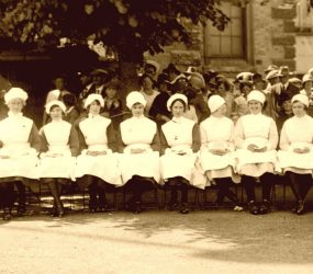 A row of seated nurses at Salisbury Carnival