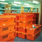 stacks of orange packing crates ready for the move