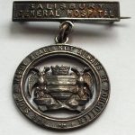Badge with words 'the sick and needy shall not always be forgotten'