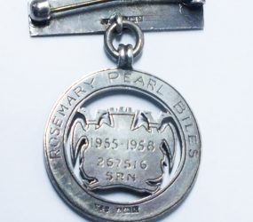 badge inscribed with Rosemary Pearl Biles, SRN, 1955-58