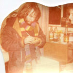 Faded colour photograph of Bill Oddie signing autographs