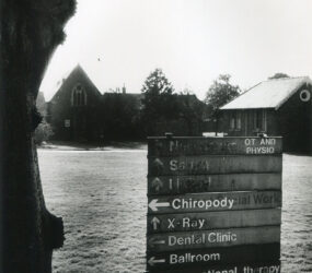 old sign board directing to Chiropody, Ballroom, OT etc...