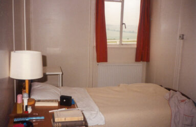 a colour photo of a bedroom with single bed and window