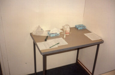 a colour photo of a table and medical test materials