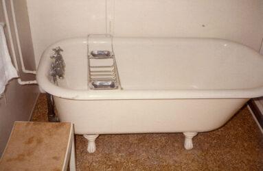 a colour photo of a metal bath on feet