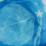 blue and white silhouette print of leaf shapes