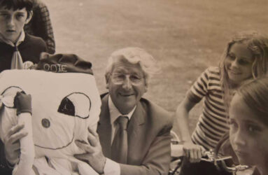 Black and white photograph of entertainer Johnny Morris and octopus mascot