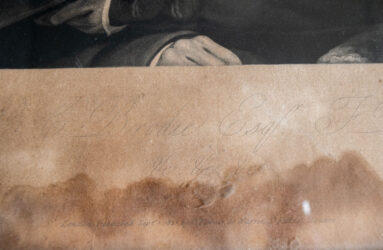 Detail on a printed engraving in script writing