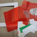 mount, red tissue paper, strips of plain paper, sheer fabric leaf shapes
