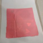 lamination pouch closed over the top of tissue paper sandwiched with cut out shapes