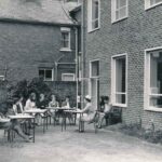 Black and white photograph showing outdoor nurse teaching class in 1970s