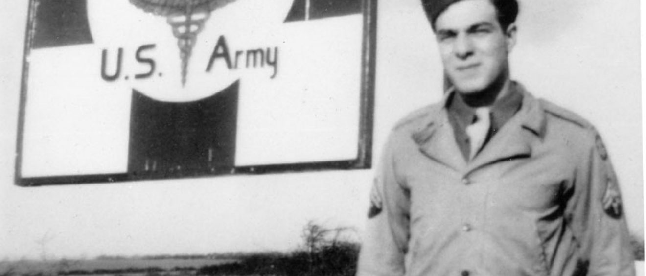 Soldier posing by the hospital sign