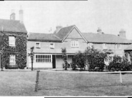 Black and white photo of buildings in a terrace