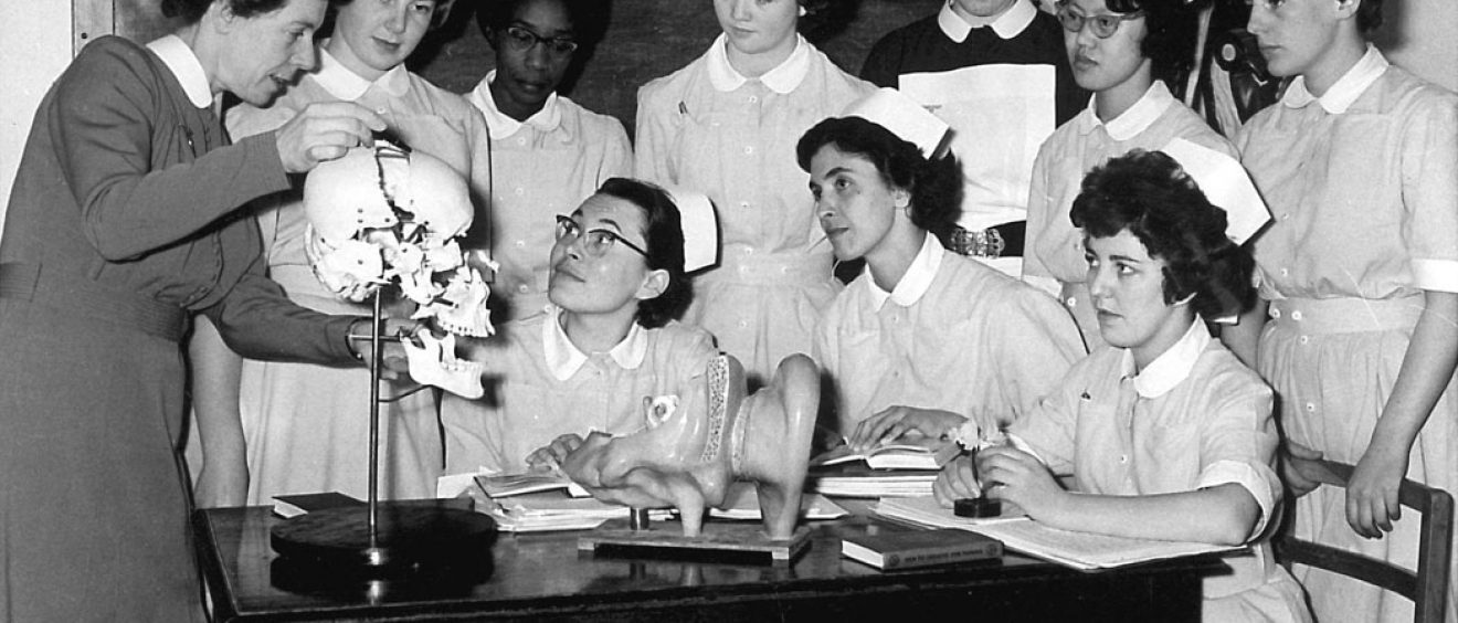 Sister showing group of nurses jawbone on skull