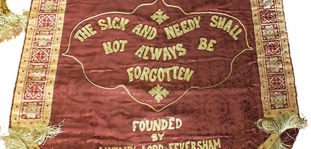 cloth banner with hospital motto 'the sick and needy shall not always be forgotten'