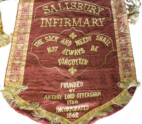 cloth banner with hospital motto 'the sick and needy shall not always be forgotten'