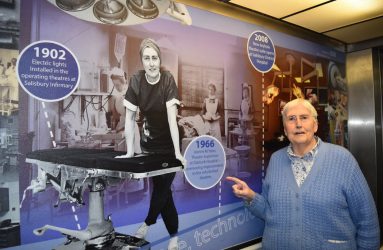 Jeanne Yates today points to photo of herself in 1966 displayed in hospital lift