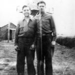 US soldiers standing in front of watch tower