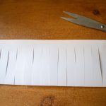 strips cut all the way along folded edge