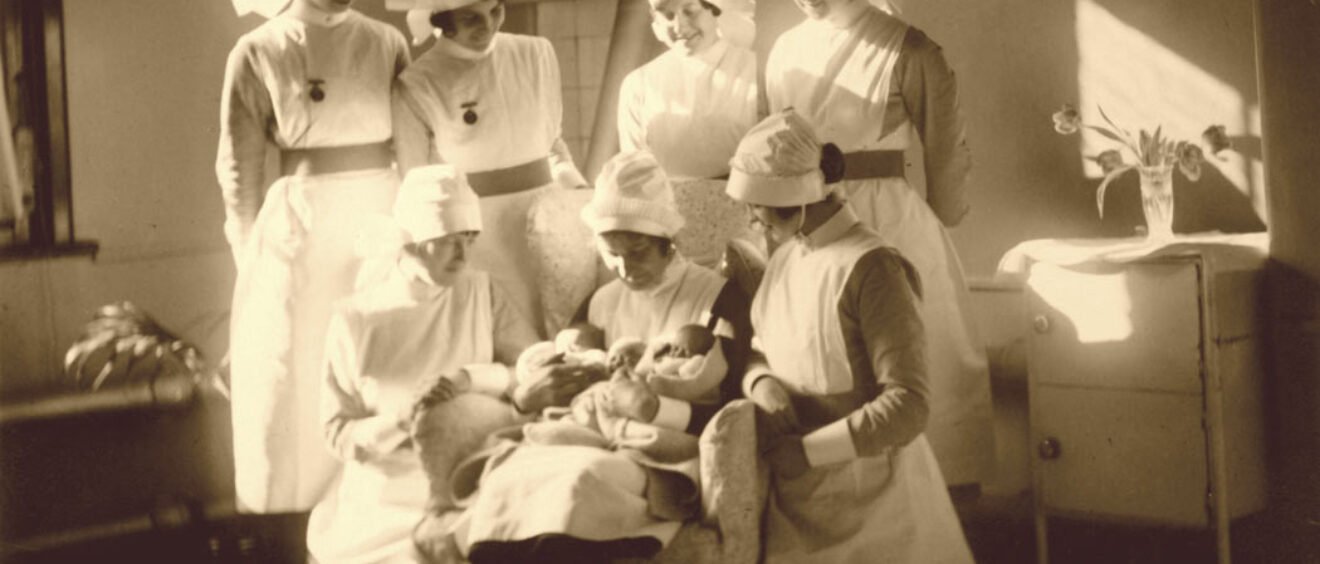 Sepia photograph of midwives in 1930s