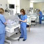 Staff overseeing babies in incubators