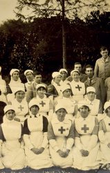 nurses with aprons and white cloth hats
