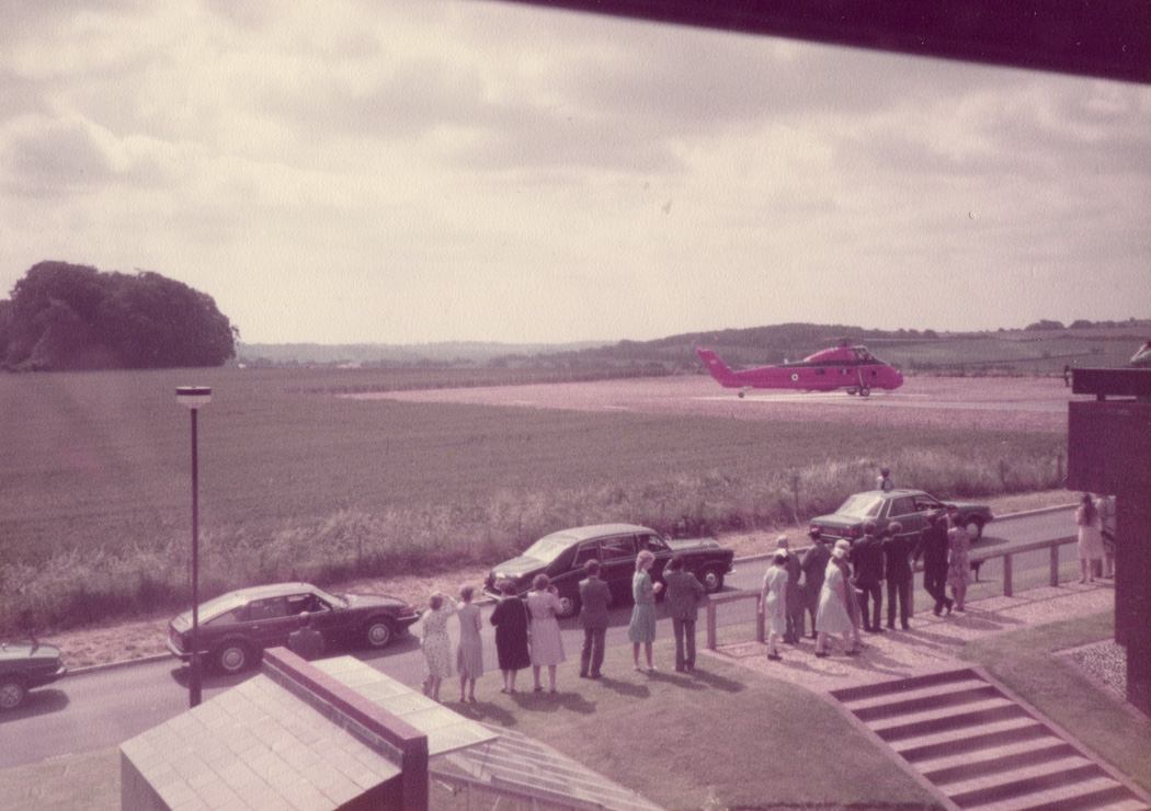 Prince and Princess of Wales arrive by helicopter to open the Spinal Unit, 1984