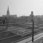 View across SGI rooftops, with cathedral spire in background