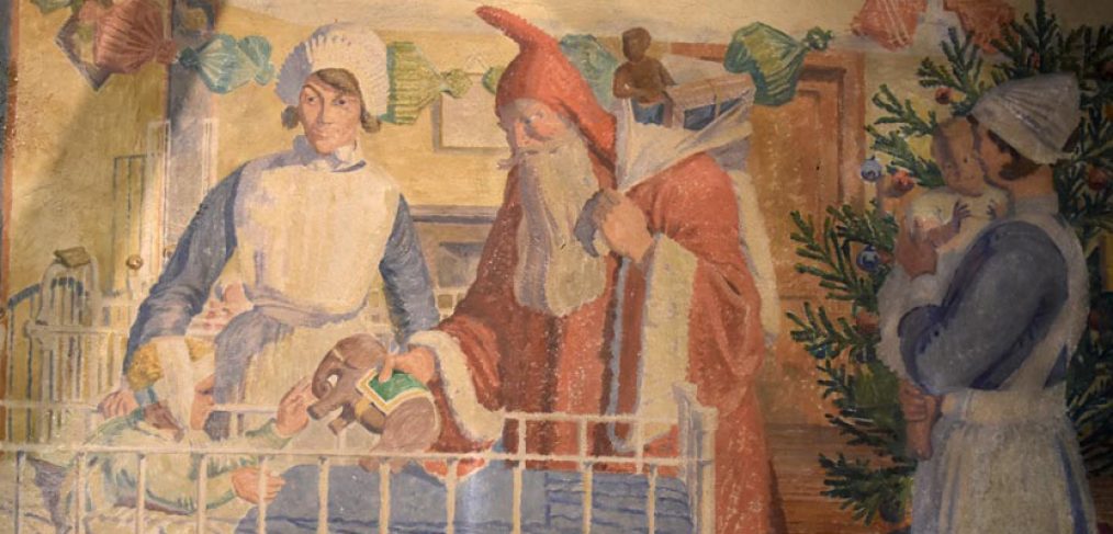 Painting showing nurse with Father Christmas giving present to child in cot